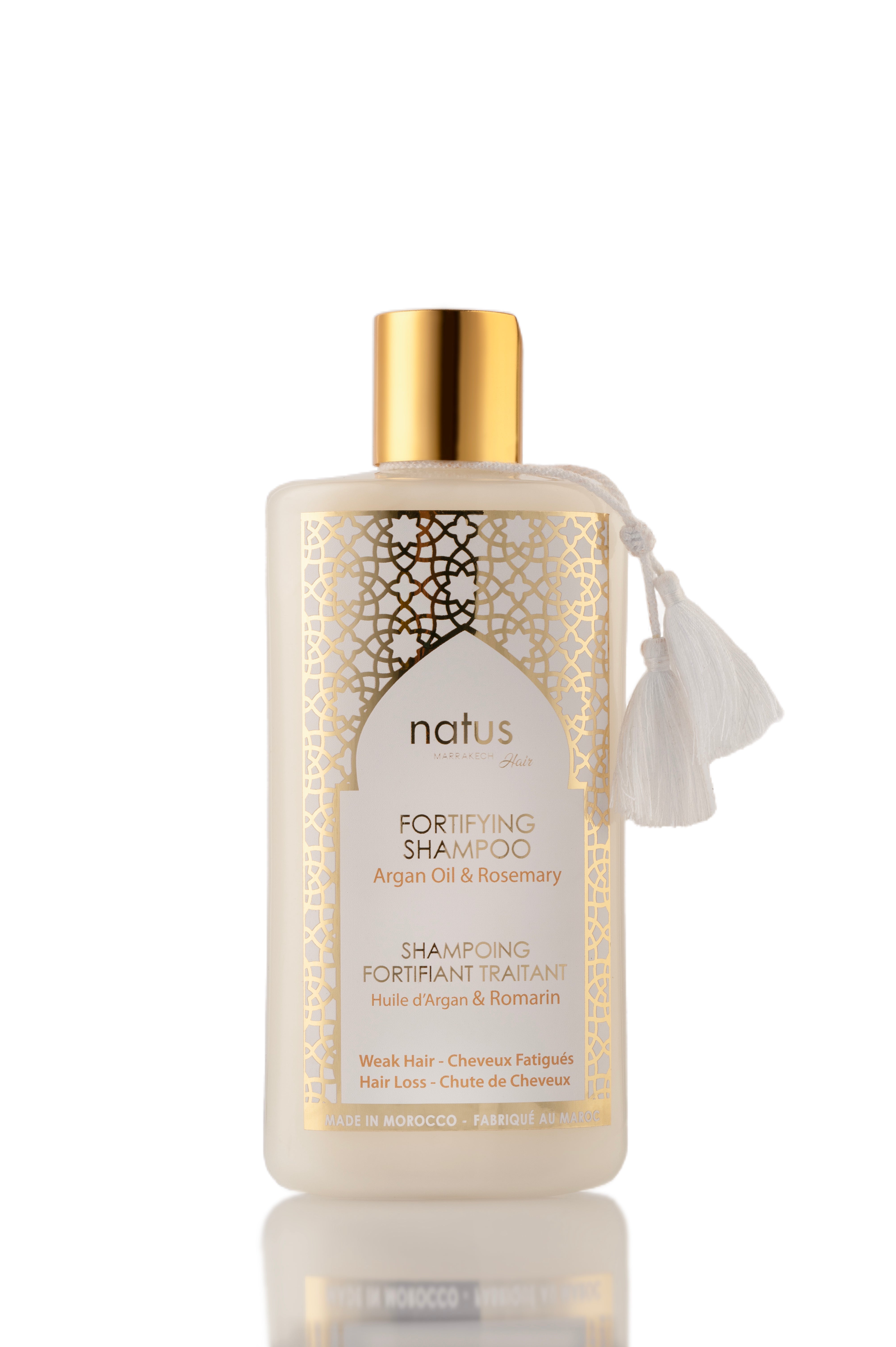 Shampooing fortifiant Natus Marrakech à l'huile d'argan et romarin, 250ml, dans une bouteille élégante avec étiquette.